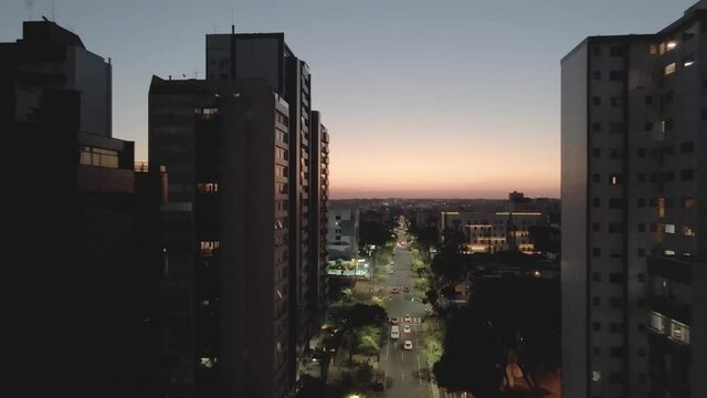 Avenida Sete de Setembro ao anoitecer em Curitiba, Paran&aacute; Brasil. urban view of Curitiba in sunshine.