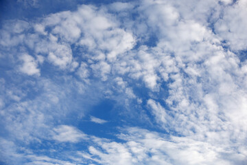 Naklejka na ściany i meble Summer blue sky with white clouds, background, copy space.