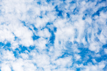 Summer blue sky with white clouds, background, copy space.