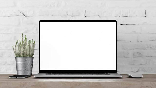 Laptop blank screen is sliding from the right side than zoom slowly with acceleration to the screen. Loft or office white brick wall background, 4k 30fps UHD