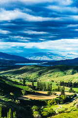 Green valley with a mountain lake