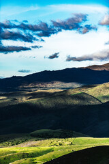 Green valley with a mountain lake