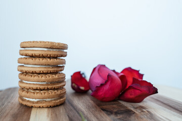 round cookies float on brown board on white background