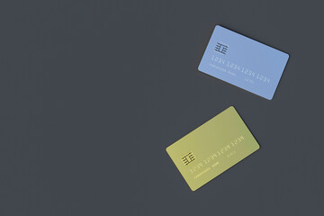 Two blank credit card gold and silver color on gray background. Concept of luxury life and wealth