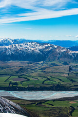 Fototapeta na wymiar Snow covered mountains and green valleys in New Zealand
