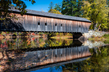 Hemlock covered bridge reflection over the Saco river