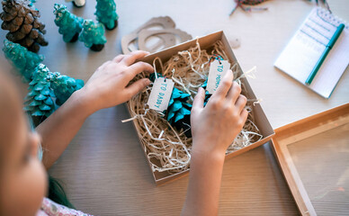 Girl preparing DIY gifts for your parents and family for Christmas, zero waste