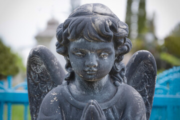 Old stone angel dark color (religion, death concept)