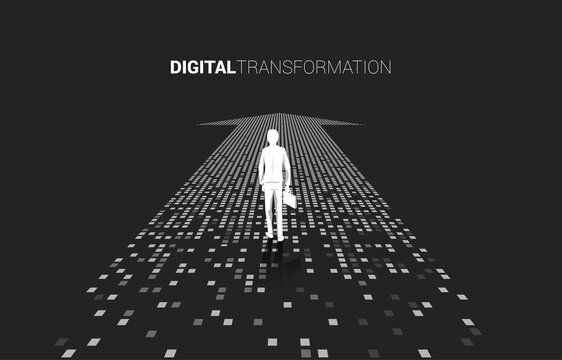 Silhouette of businessman standing on the arrow from pixel. concept of digital transformation of business.