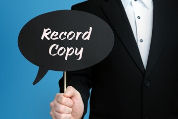 Record Copy. Businessman holds speech bubble in his hand. Handwritten Word/Text on sign.