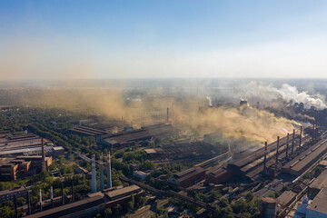 Factories emit harmful emissions into the atmosphere.