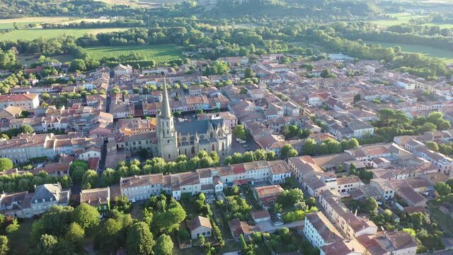 Scenic aerial view of Mirepoix town and surroundings in Hers valley in summer overlooking Gothic building of Roman Catholic Cathedral, France