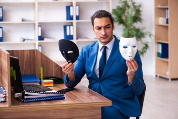 Young male employee wearing mask in the office