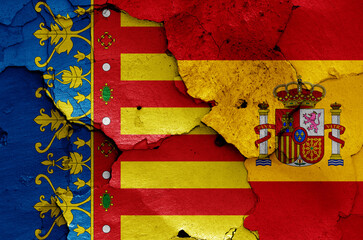 flags of Valencian Community and Spain painted on cracked wall