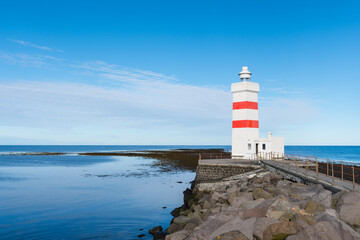 Fototapeta na wymiar The old Gardskagaviti lighthouse on the coast of Iceland