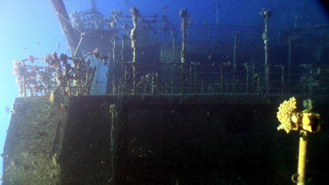 Deck of ship Salem Express wrecks underwater in Red Sea in Egypt. Extreme tourism on ocean floor in world of coral reefs, fish, sharks. Researchers of wildlife blue abyss. Deep diving.