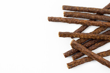 a group of natural formed dog treats, beef, chicken, pork, lamb meat sticks on white background