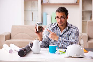 Young male architect working from house during pandemic