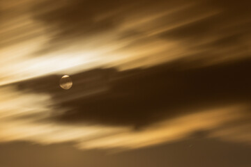 Super moon. An attractive photo of the night sky background with a cloudy and bright full moon. Night sky with a beautiful full moon.