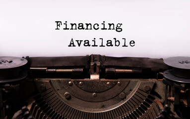text Financing available typed words on a vintage typewriter. Business startup concept.