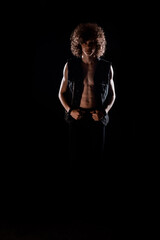 Rock guy with curly afro hair posing