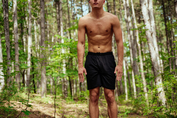 Fitness exercise. athletic active man with fit muscular body stretching, exercising before running