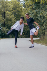 Male and female athletes preparing for a marathon, run, workout. Healthy lifestyle concept.