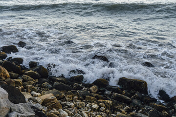 ocean waves hitting the beach stones, landscape, copy space