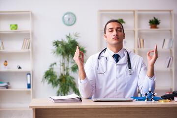 Young male doctor working in the clinic