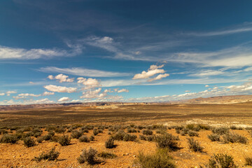 Fototapeta na wymiar Beautiful thick low clouds over the desert horizon, Wahweap lookout, Page, AZ
