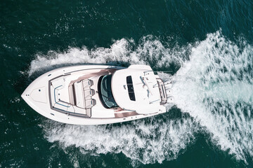 Small private yacht in the sea with beautiful turquoise wave in ocean.