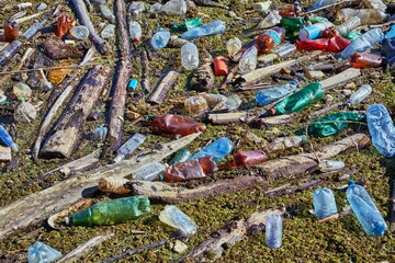Plastic waste drifting in polluted water accumulated at a dam, environmental problems