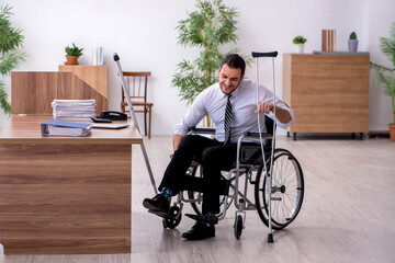 Young disabled employee suffering at workplace