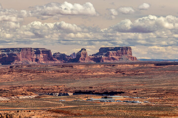 Giant hills and flat man made structures coexist in Page, AZ