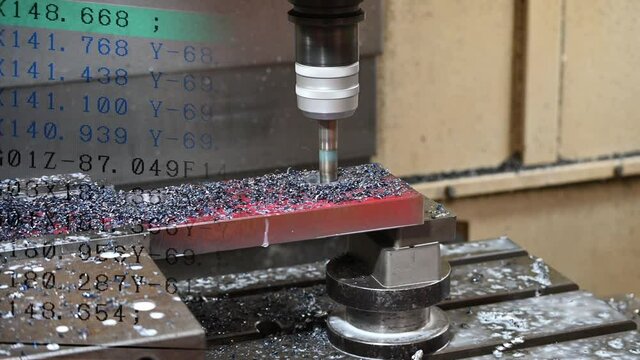 Abstract scene of CNC milling machine and G-code data background. The hi-technology mold and die manufacturing concept by machining center.