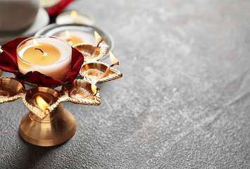 Diya lamp for celebration of Divaly on dark background