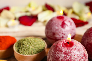 Burning candles with spices for celebration of Divaly on table, closeup