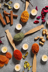 Festive composition with burning candles and spices for celebration of Divaly on grey background