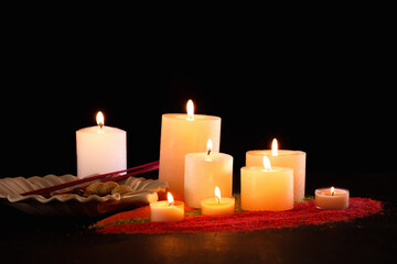 Obraz na płótnie Canvas Burning candles for celebration of Divaly on dark background