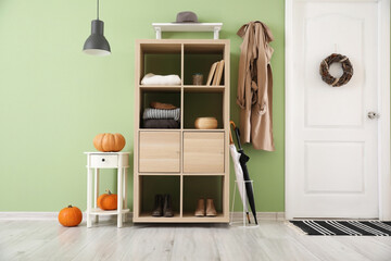 Stylish interior of modern hall with autumn decor