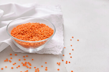 Bowl with raw lentils on light table