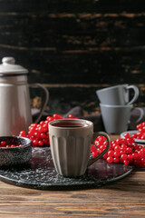 Cup of healthy viburnum tea on table