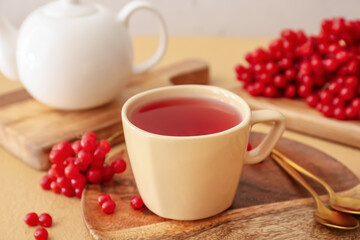 Obraz na płótnie Canvas Cup of healthy viburnum tea on table
