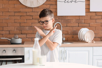 Little boy with dairy allergy in kitchen