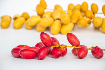 Fresh red date palm on white background