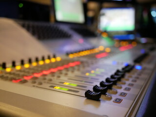 blurred of audio mixer control in studio at TV station.
