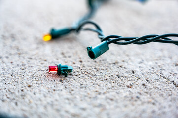 Prep work for installing Christmas decorations of testing and repairing dead bulbs