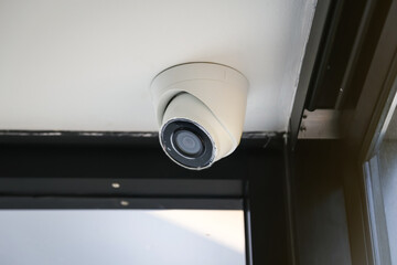 Indoor CCTV security camera operating in an office.