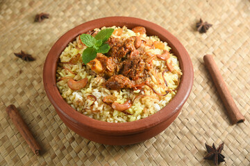 Mutton biryani , Gosht or lamb biryani or Hyderabadi Dum biriyani with raita yoghurt dip special occasion festival food  for Ramadan , Eid Hyderabad India.