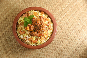 Mutton biryani , Gosht or lamb biryani or Hyderabadi Dum biriyani with raita yoghurt dip special occasion festival food  for Ramadan , Eid Hyderabad India.